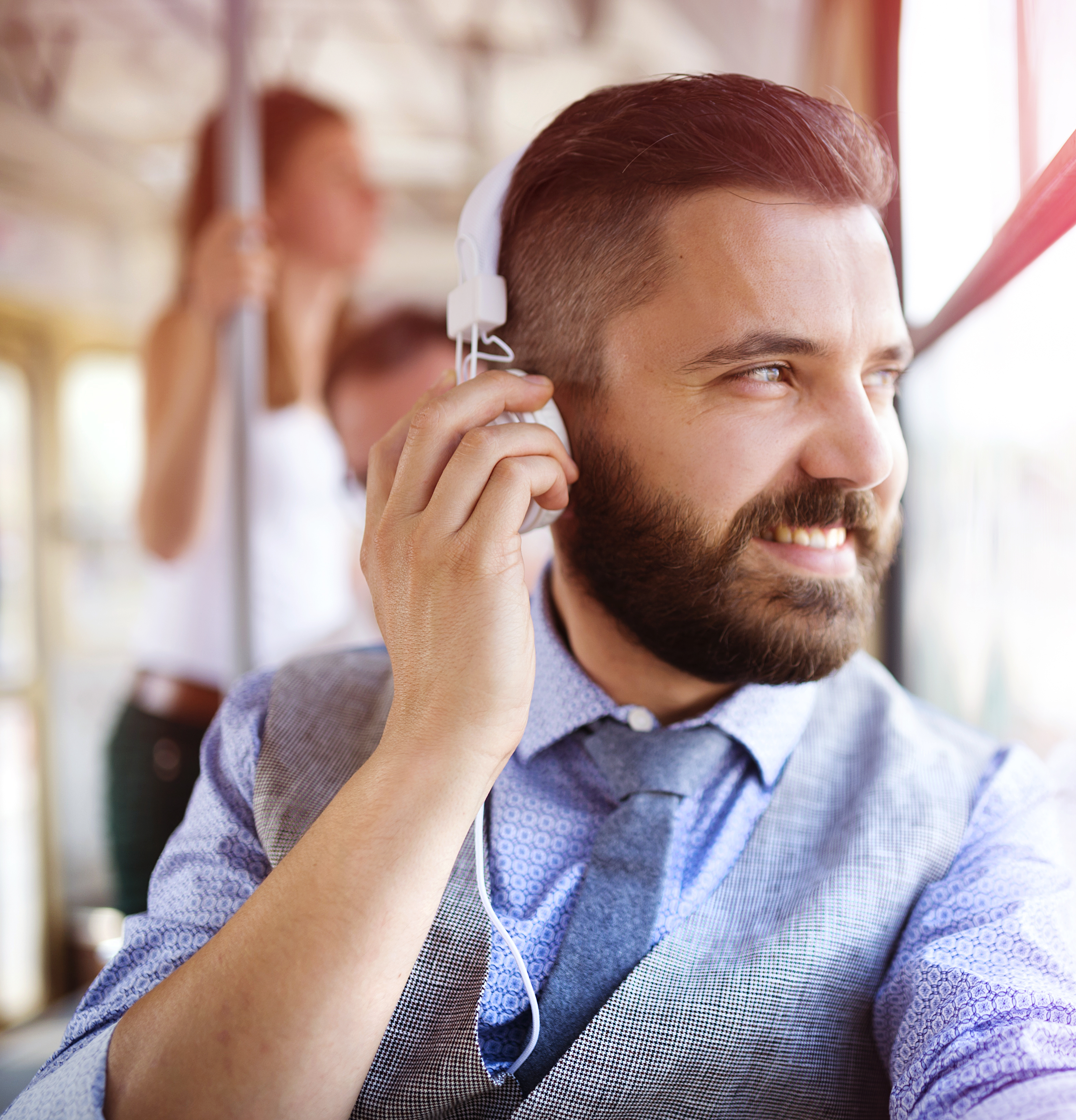 graphicstock handsome hipster modern man with headphones traveling by tram in town SARcBnZZ